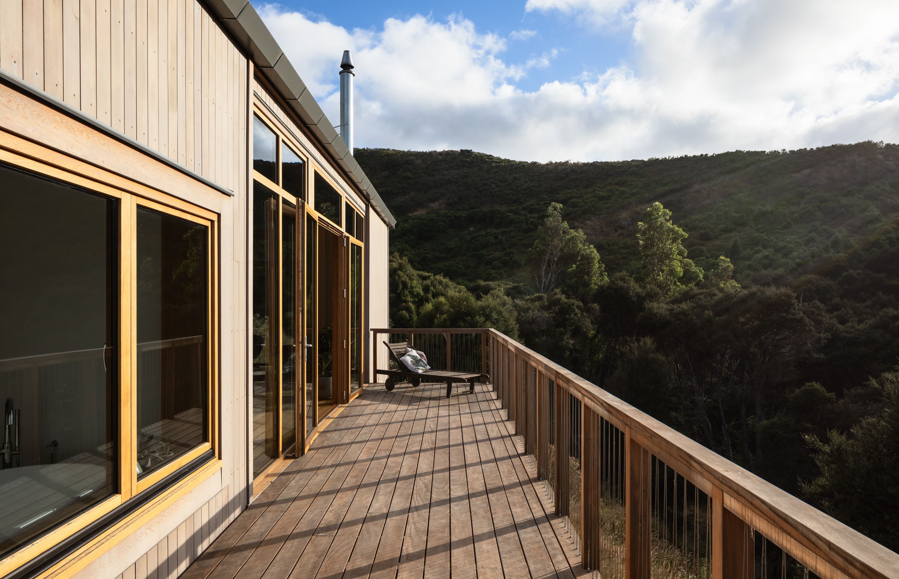 The suspended balcony takes in the panoramic view as it extends down the length of the building.