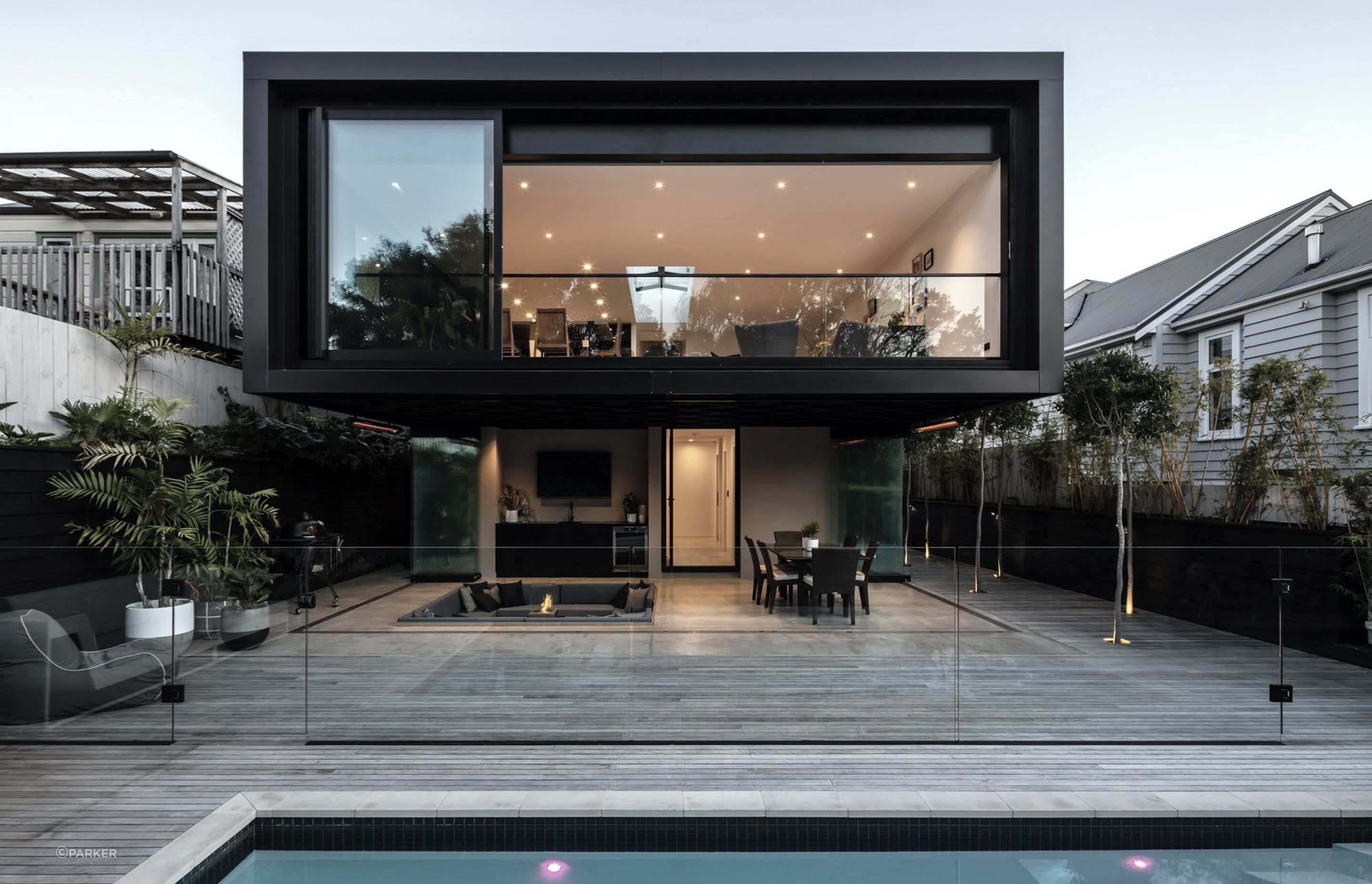 The two-storey extension features an open-plan living area upstairs and a covered outdoor area leading onto a newly installed swimming pool.