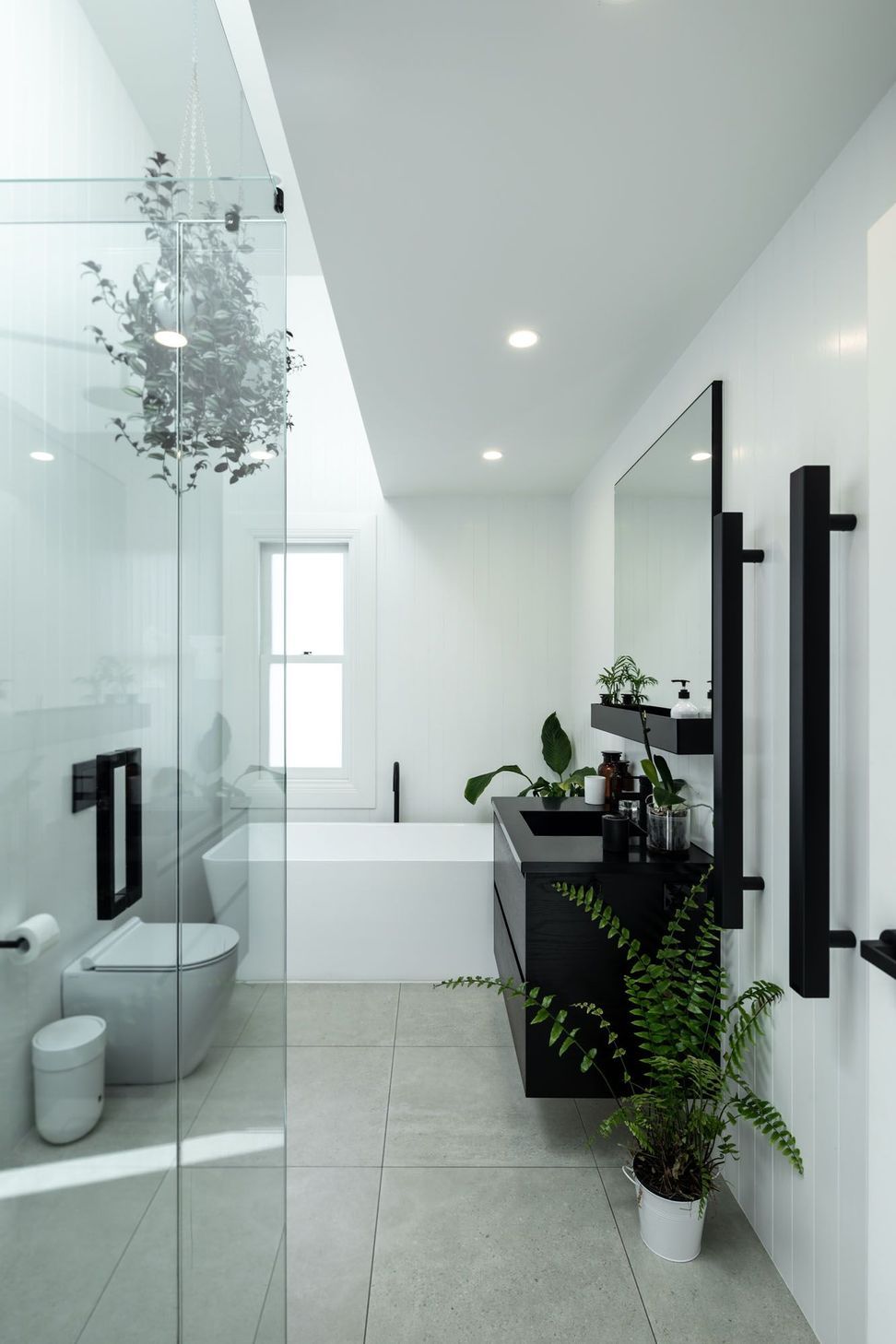 The black and white colour scheme is fully realised in the bathrooms.