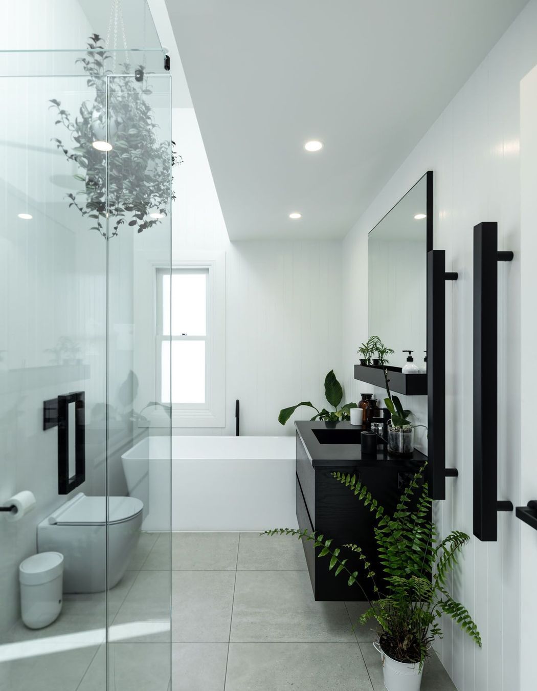 The black and white colour scheme is fully realised in the bathrooms.