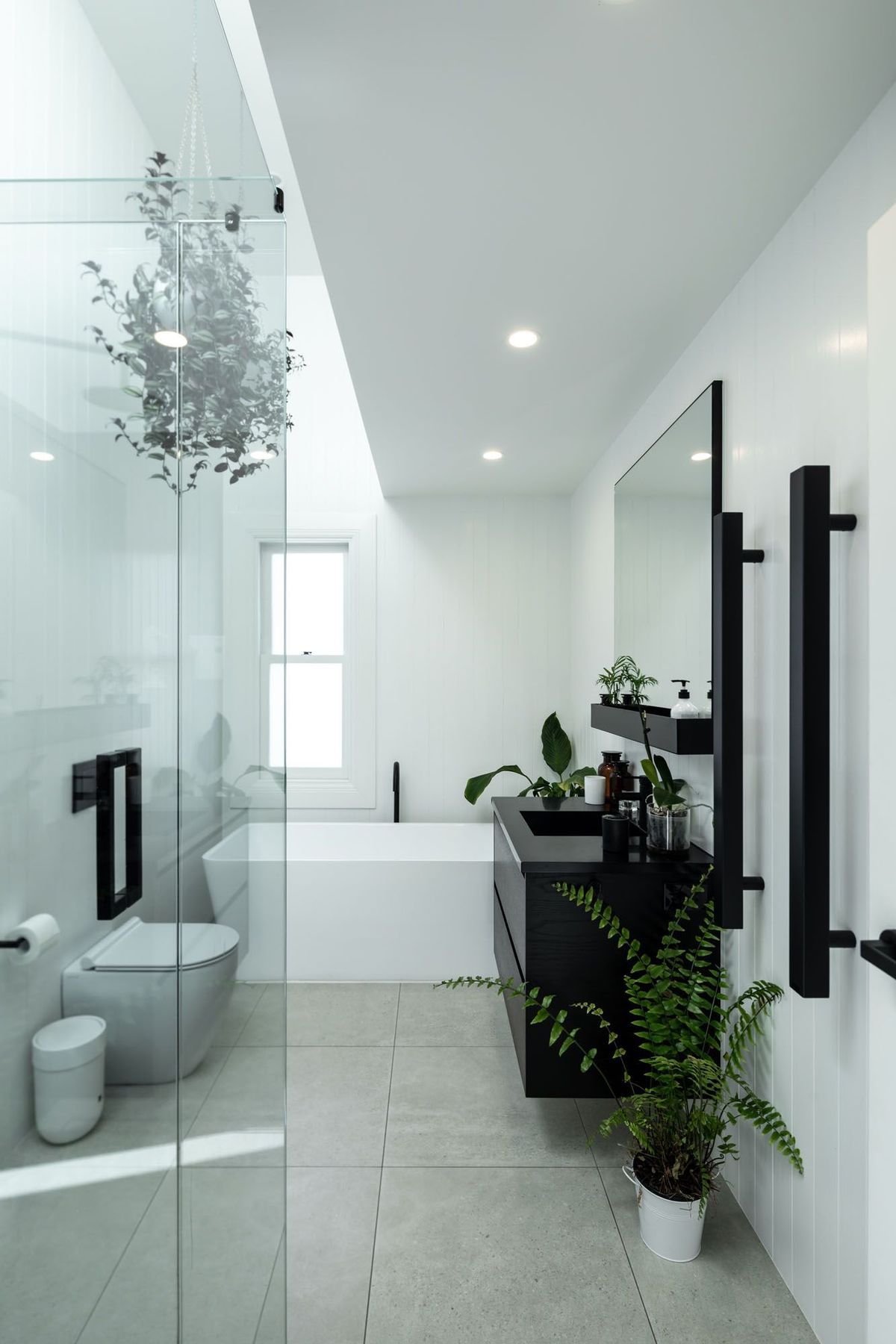 The black and white colour scheme is fully realised in the bathrooms.