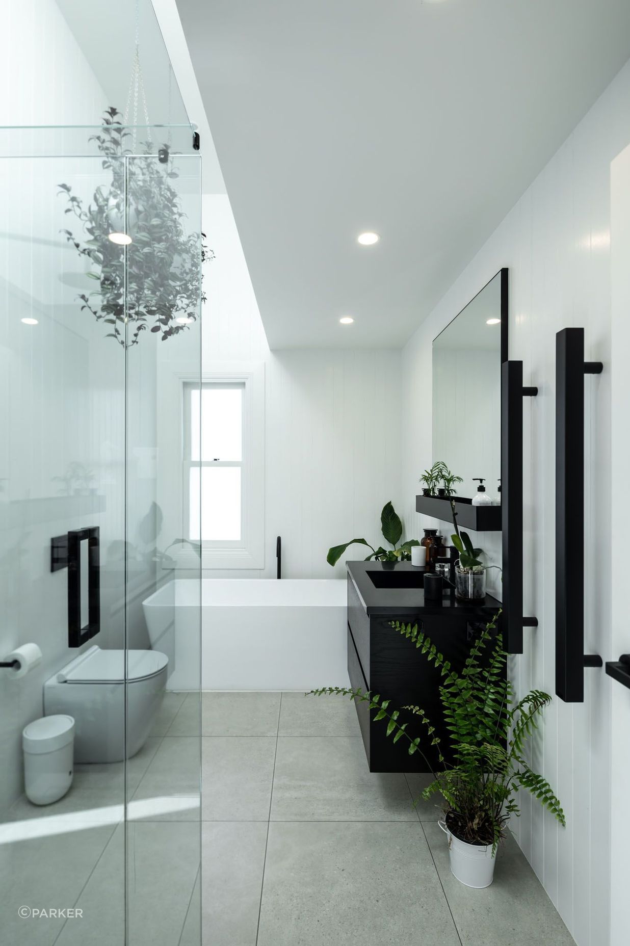 The black and white colour scheme is fully realised in the bathrooms.