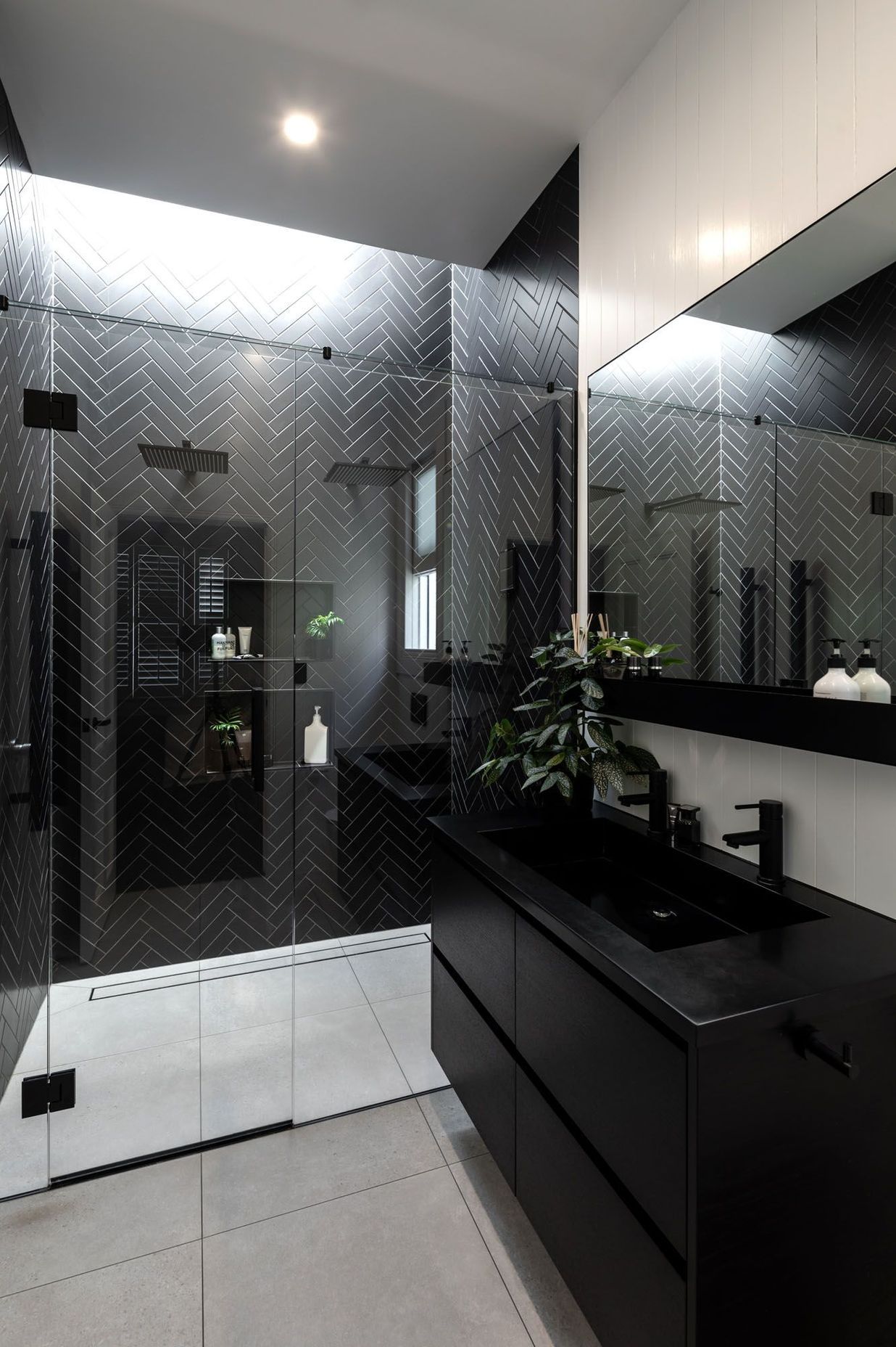 The black and white colour scheme is fully realised in the bathrooms.