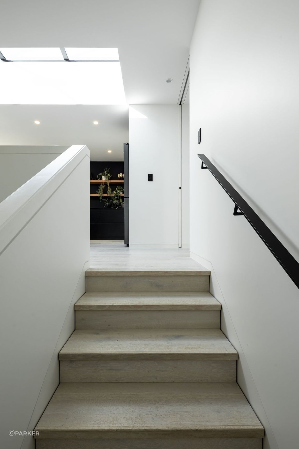 A full-height cavity door at the junction of the extension and the original villa can be pulled across to separate the two structures.