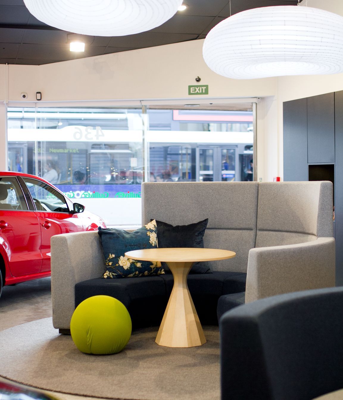 Fletcher Design Realm seating systems covered in pure New Zealand wool by Camira Fabrics add a warm foil to the hardness of the shiny vehicles. 
