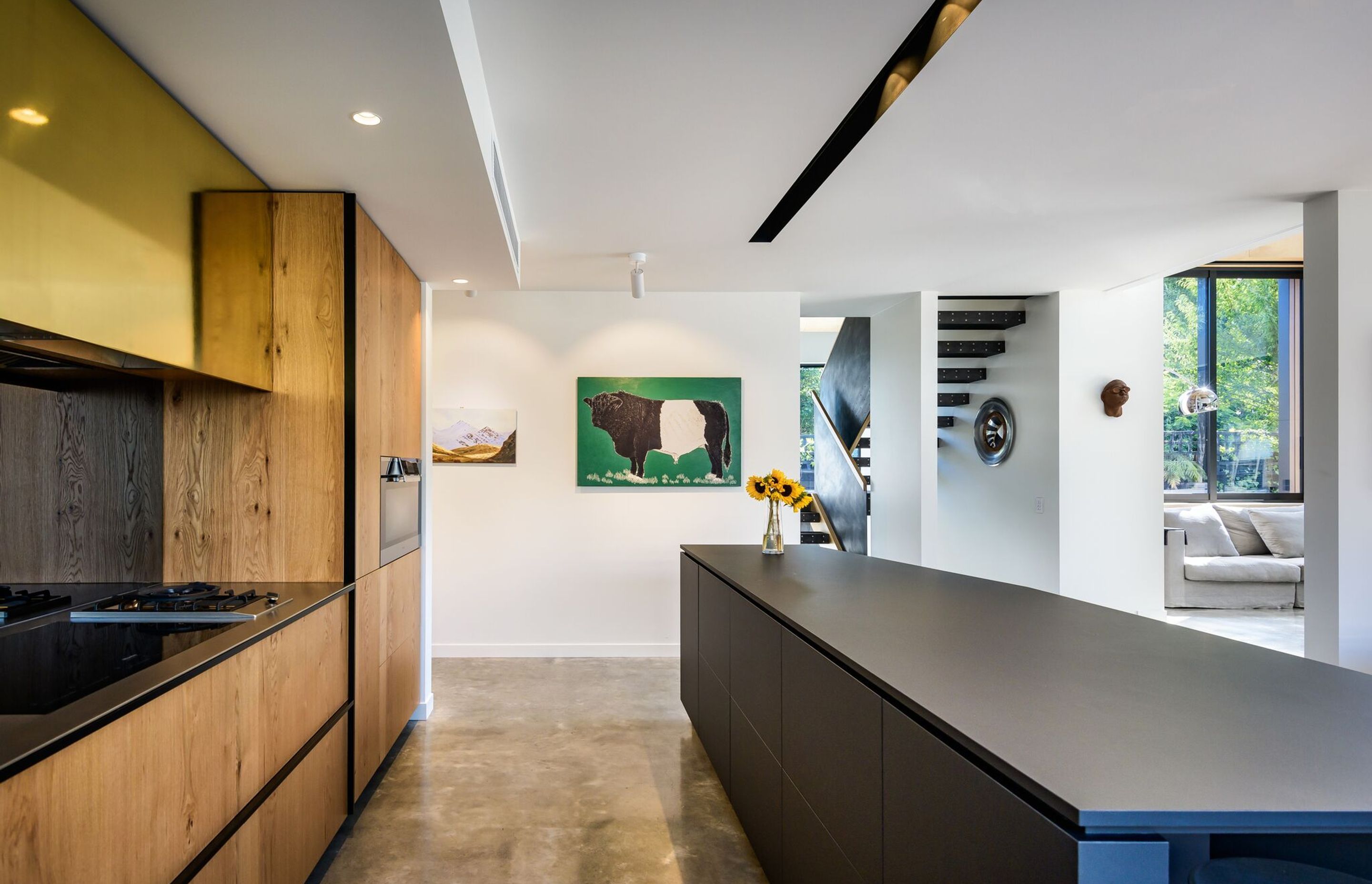 The long kitchen island is a sculptural feature of the house that's ideal for making longer lengths of pasta, says the architect and homeowner Tim Dagg.