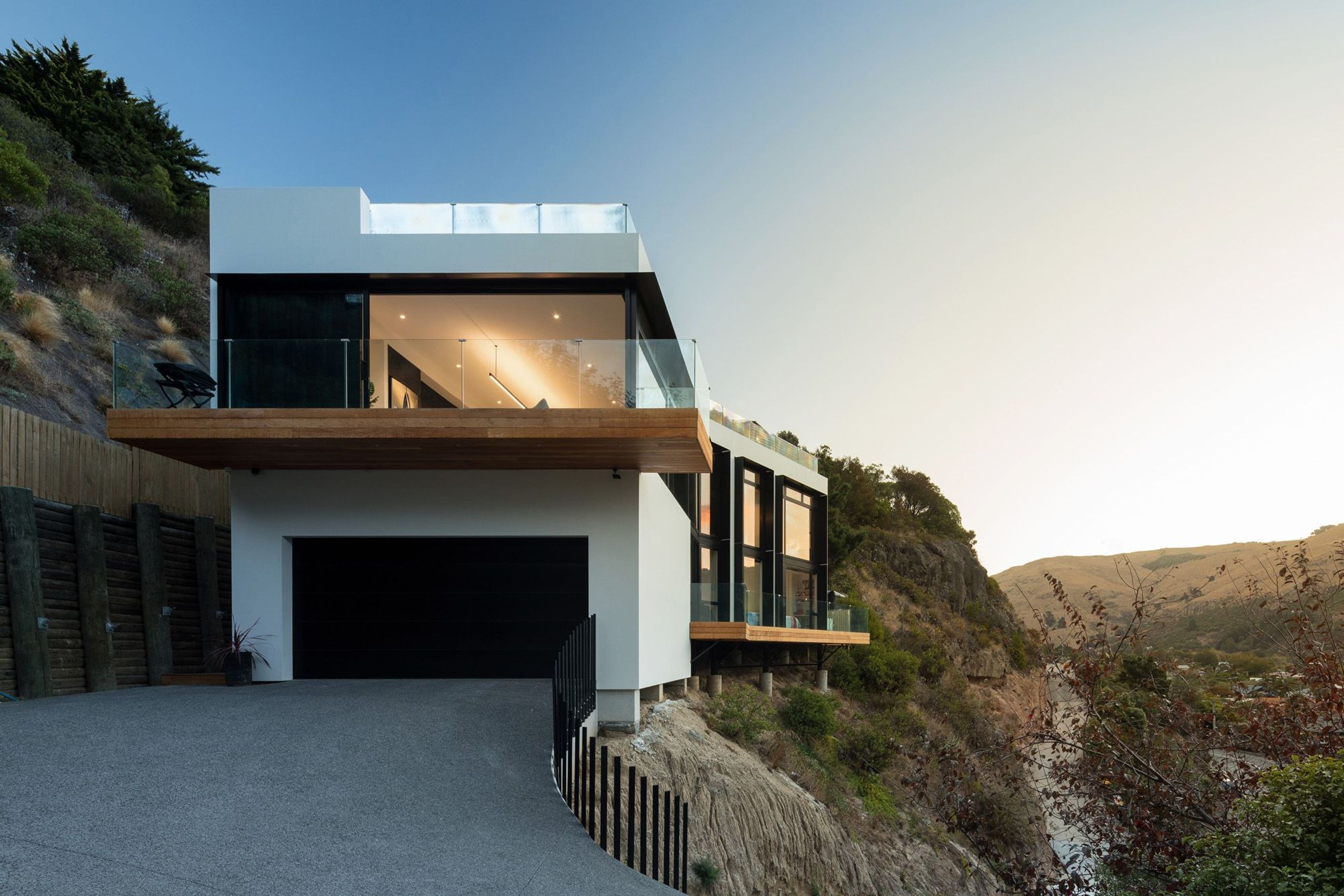 The house as seen from the driveway, shows the garage and the cantilevered terraces from the ground-floor bedrooms and games' room and from the first-floor living area.
