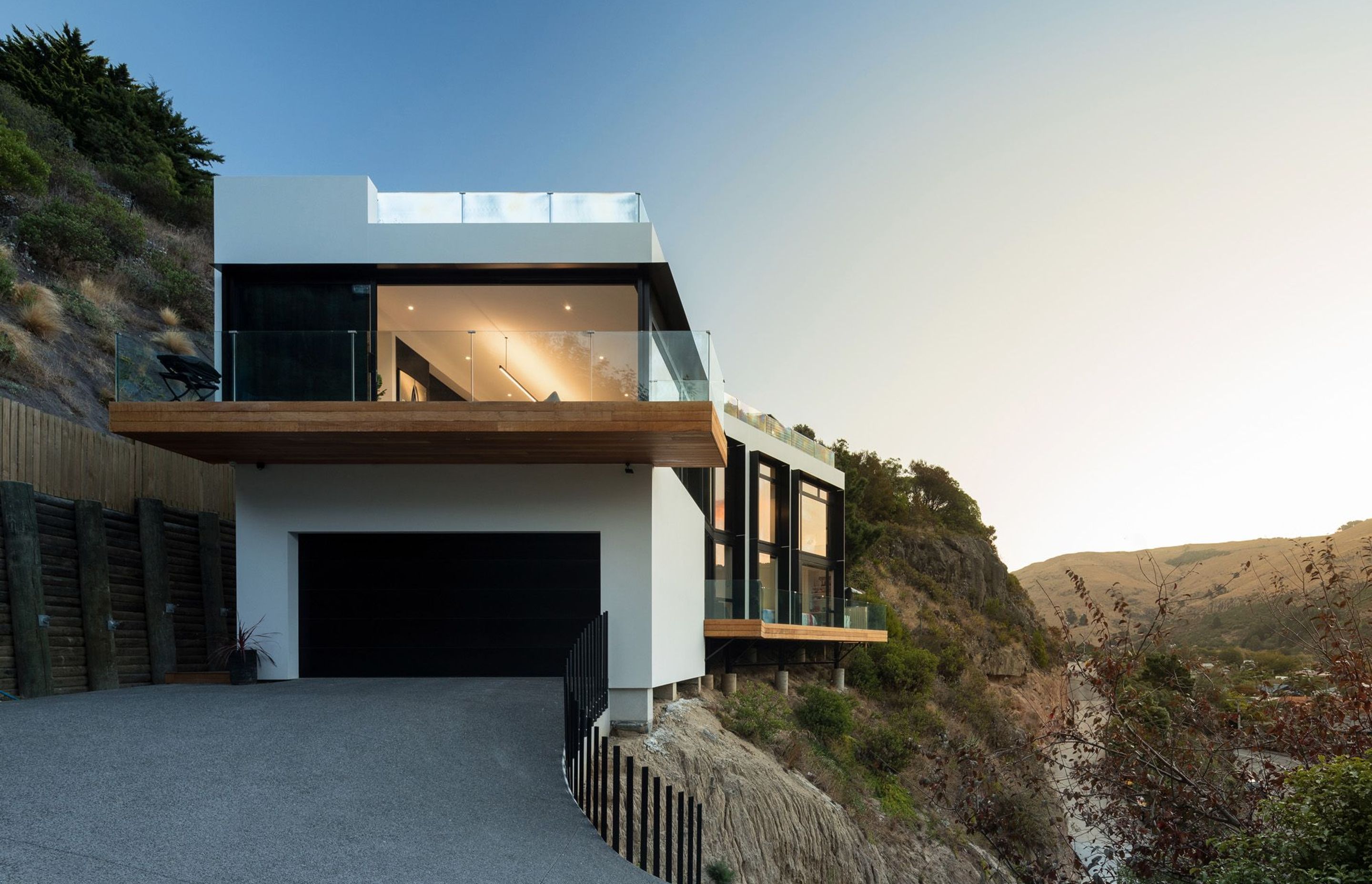 The house as seen from the driveway, shows the garage and the cantilevered terraces from the ground-floor bedrooms and games' room and from the first-floor living area.