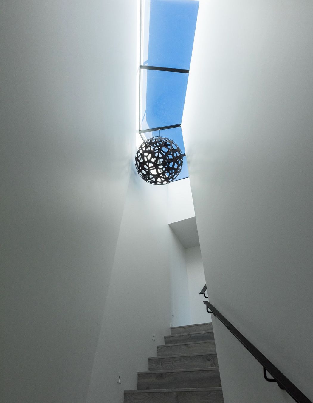 The dramatic stairwell up to the roof terrace.