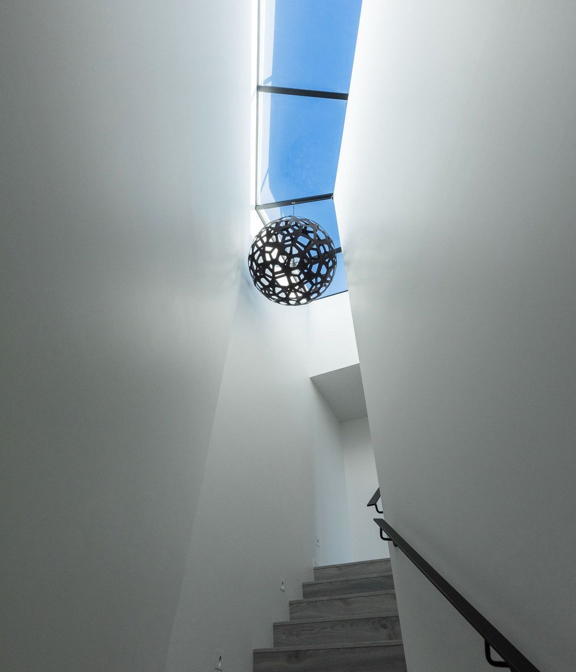 The dramatic stairwell up to the roof terrace.