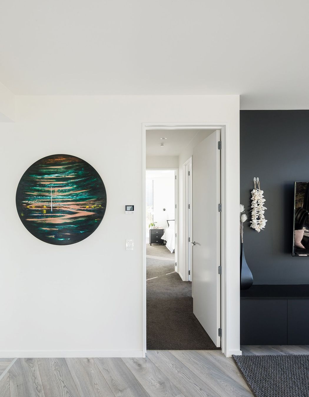 Looking down the hallway to the master bedroom suite.