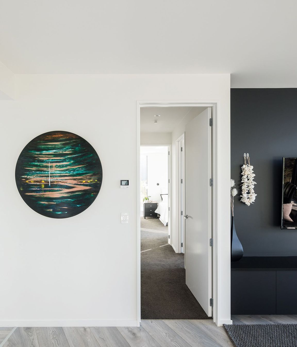 Looking down the hallway to the master bedroom suite.