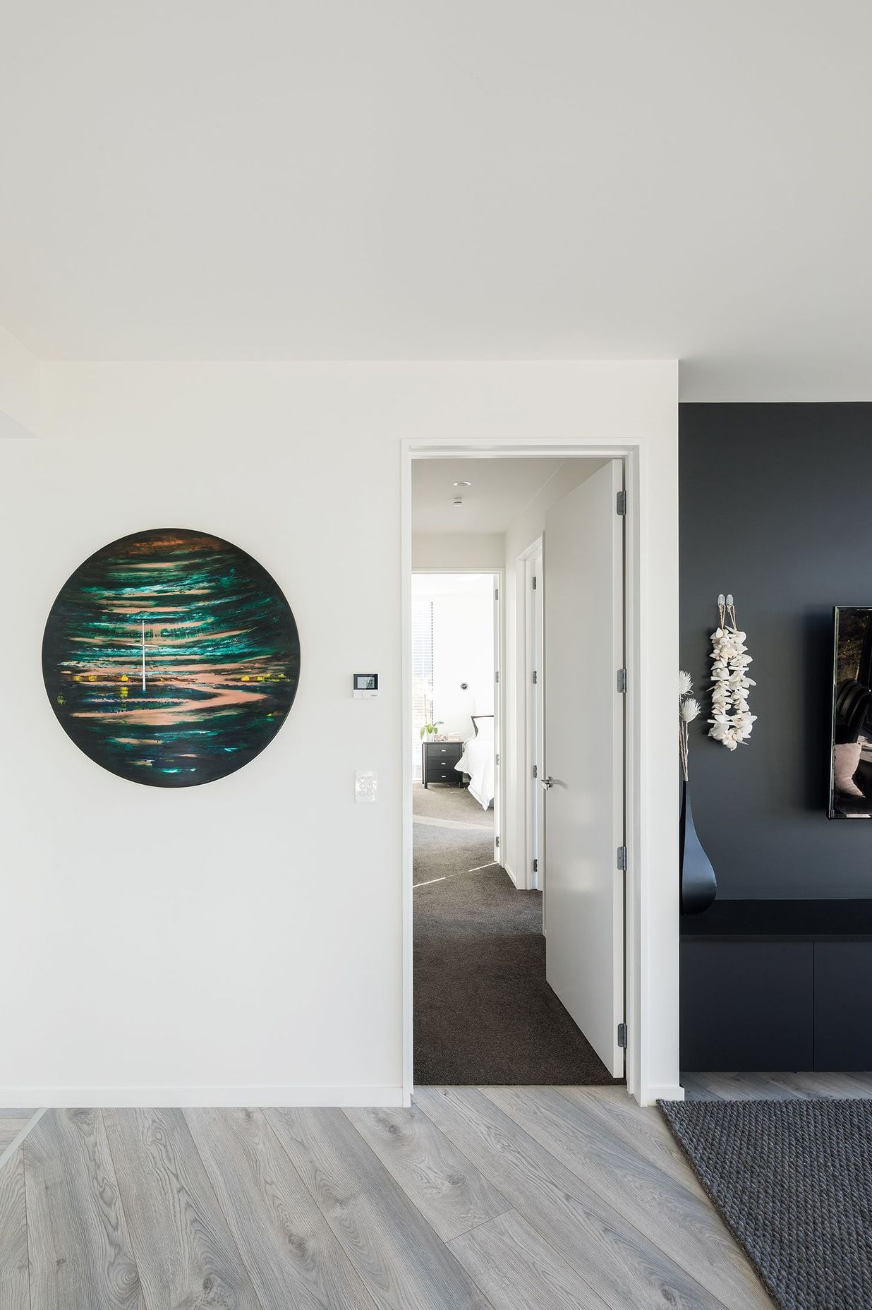 Looking down the hallway to the master bedroom suite.