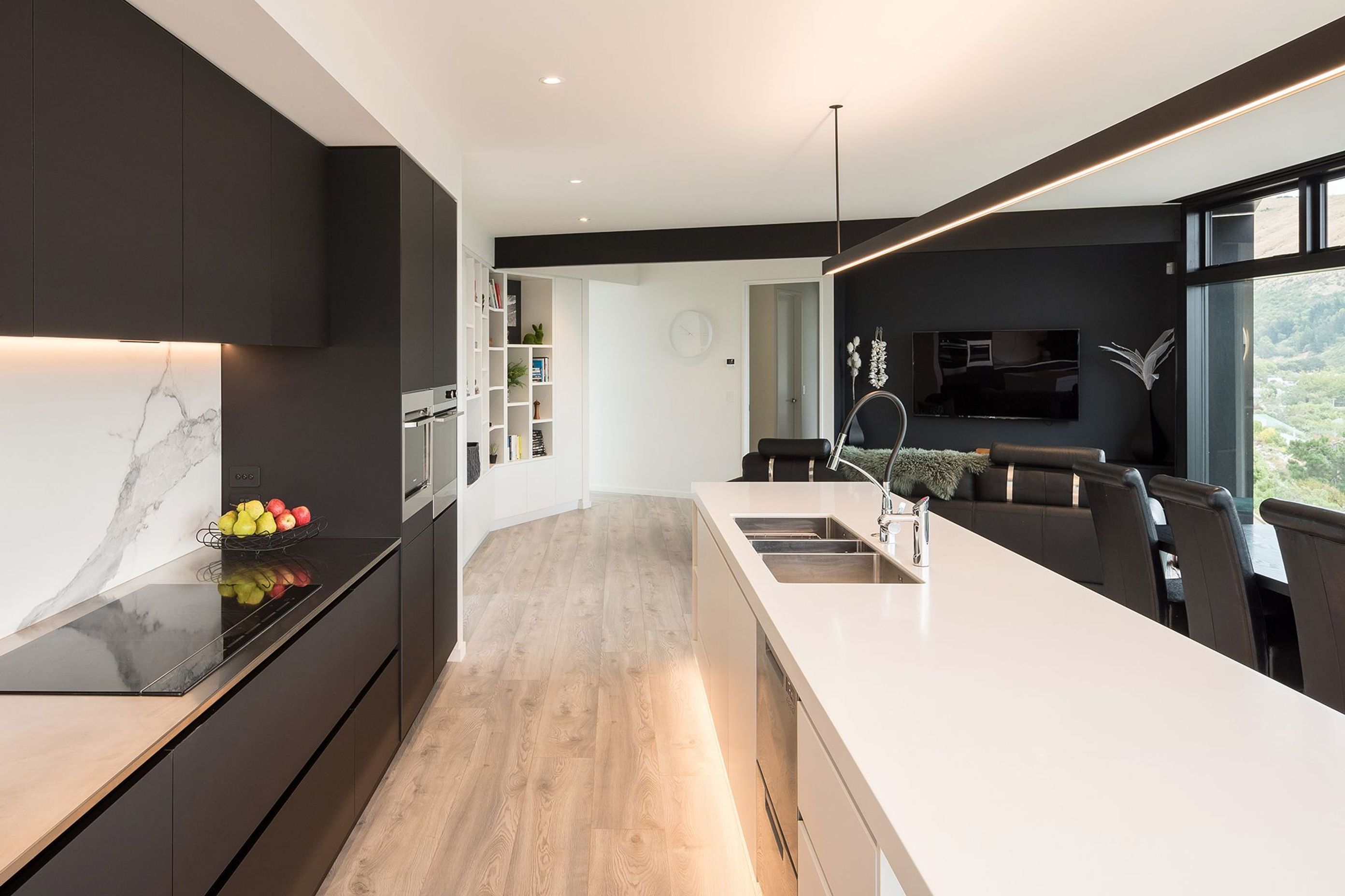 A sleek, minimalist kitchen provides the ideal backdrop to the spectacular view of the Canterbury coastline.