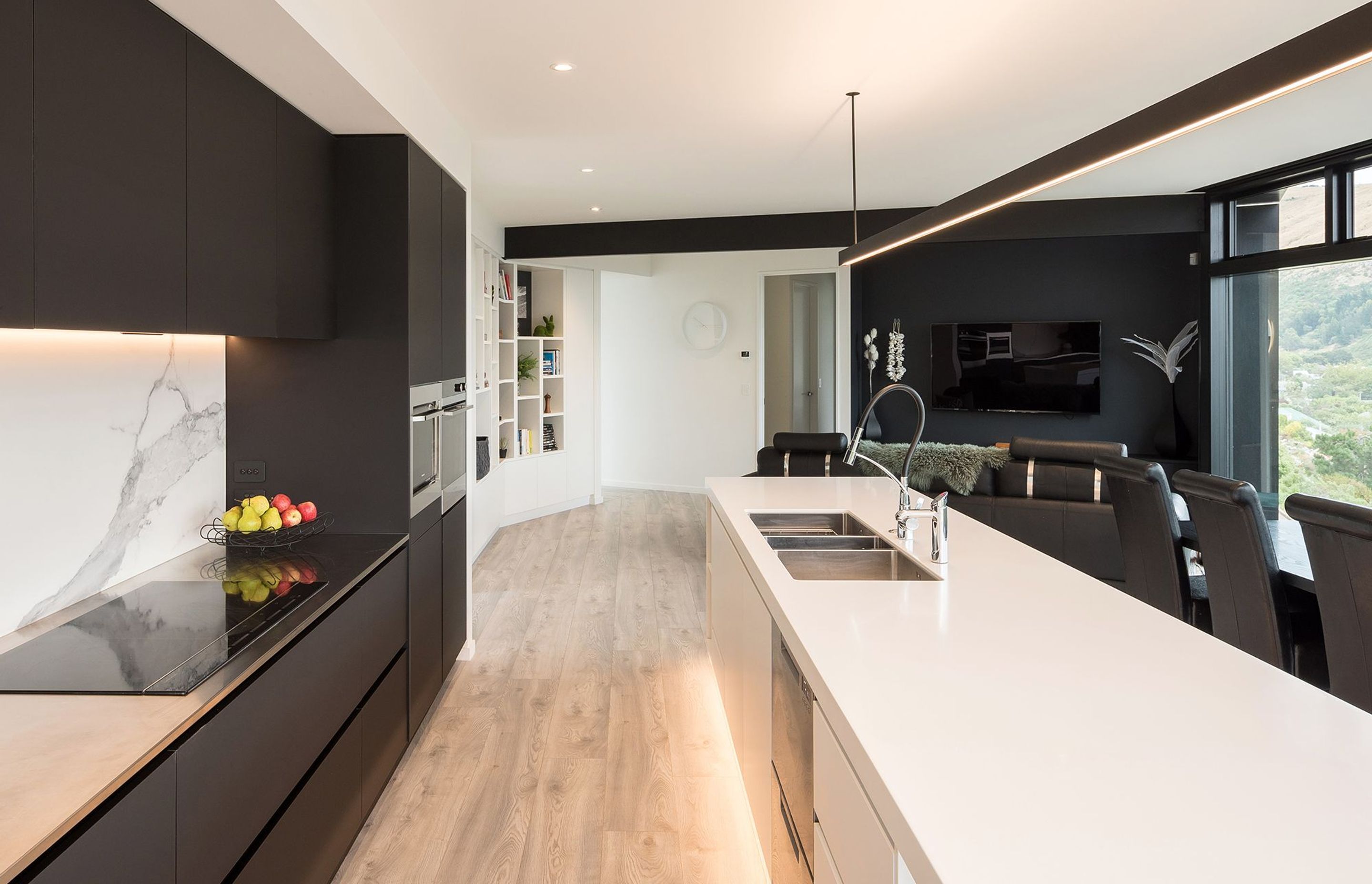 A sleek, minimalist kitchen provides the ideal backdrop to the spectacular view of the Canterbury coastline.