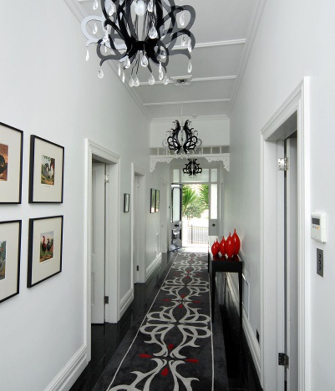 A custom designed floor run to connect with the contempory chandelier pendant lights.