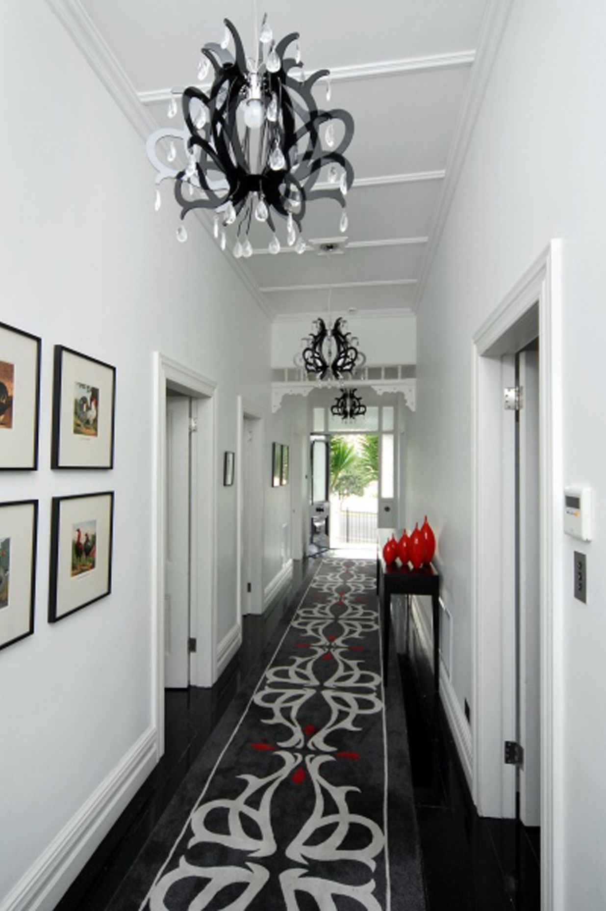 A custom designed floor run to connect with the contempory chandelier pendant lights.