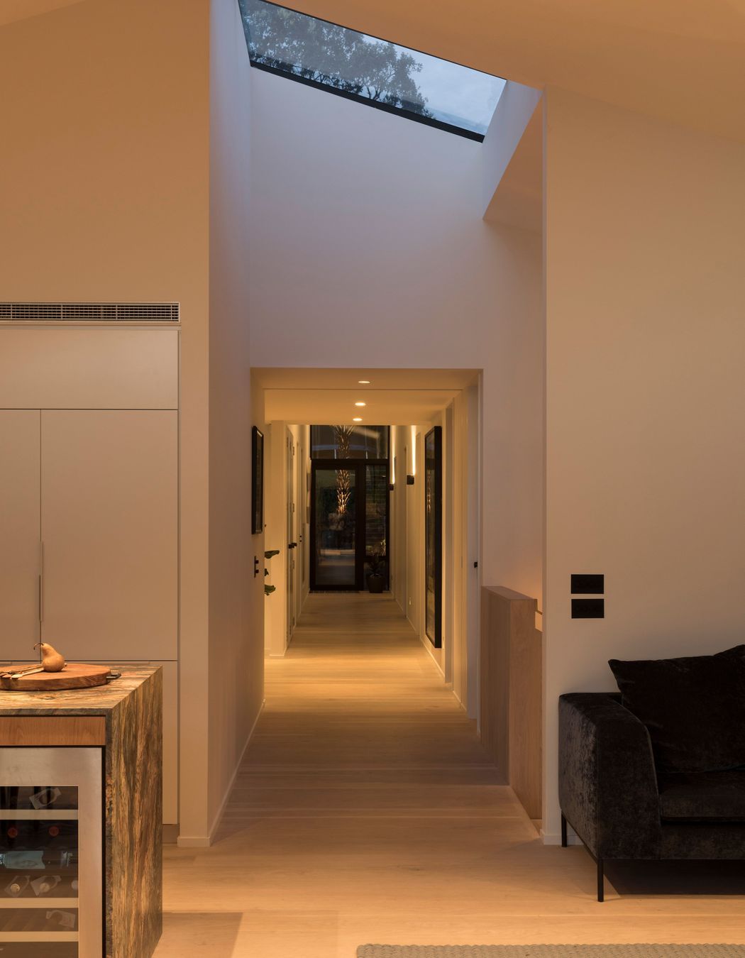 A long corridor creates a central axis on the first floor.
