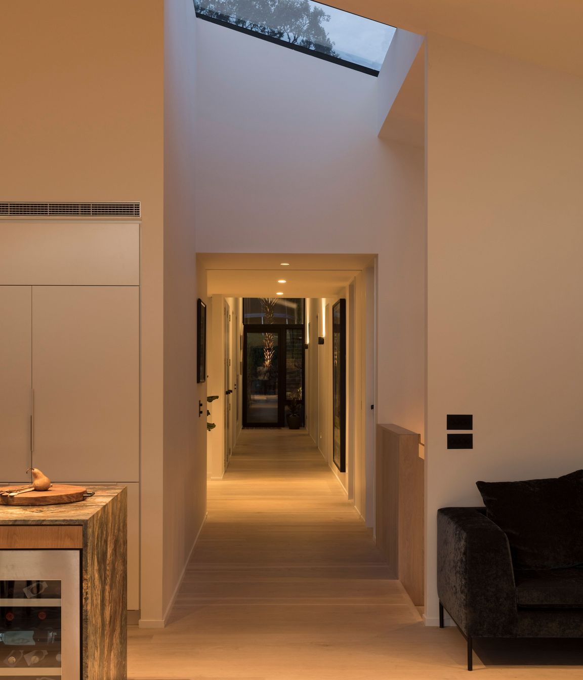 A long corridor creates a central axis on the first floor.