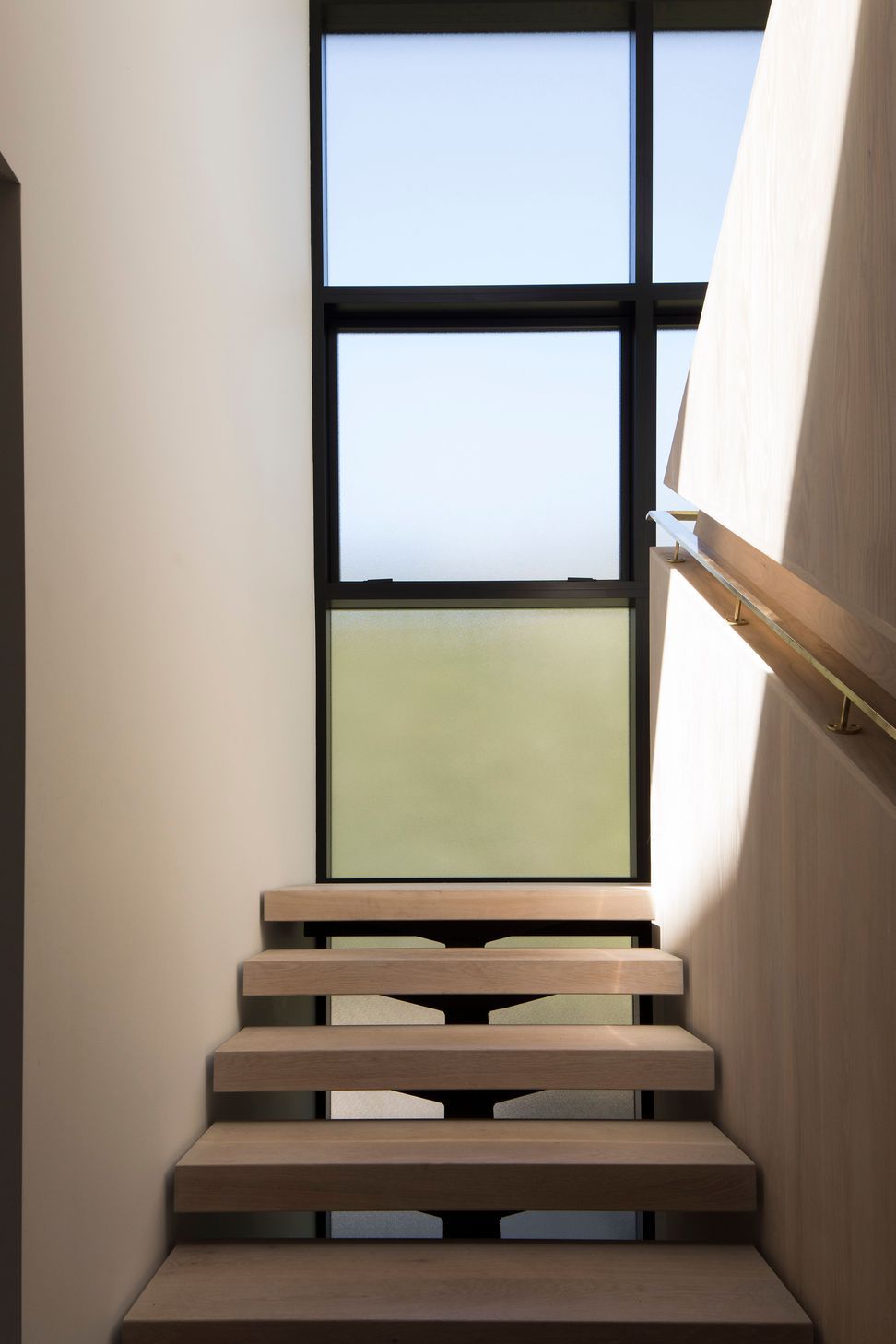The staircase landing makes the most of the light and the surrounding views.