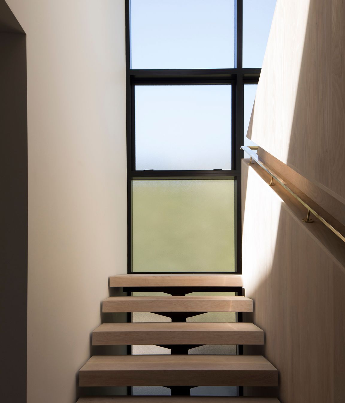 The staircase landing makes the most of the light and the surrounding views.