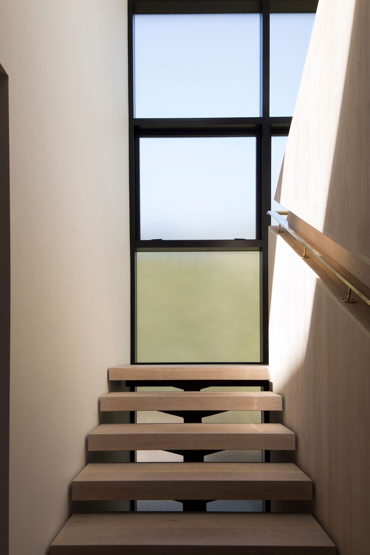 The staircase landing makes the most of the light and the surrounding views.