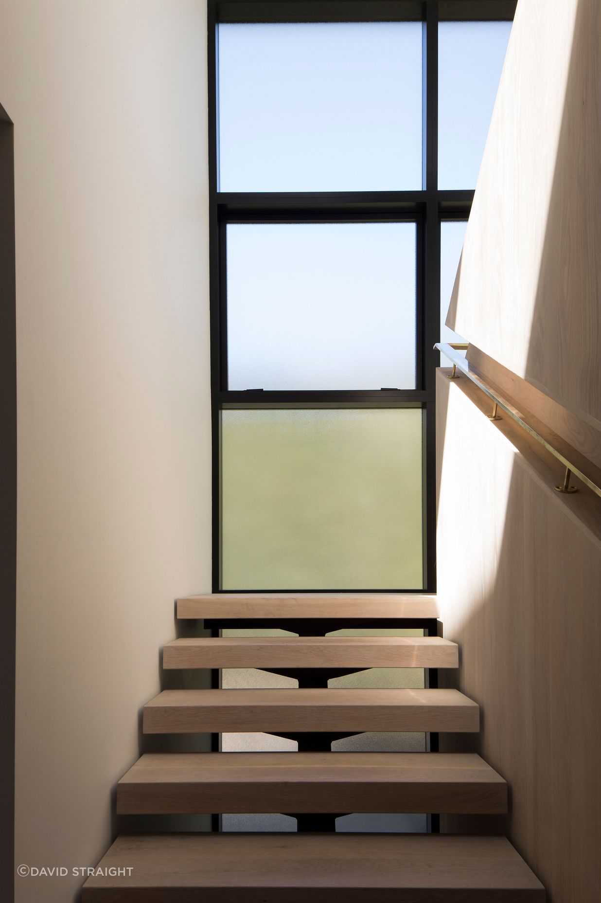 The staircase landing makes the most of the light and the surrounding views.