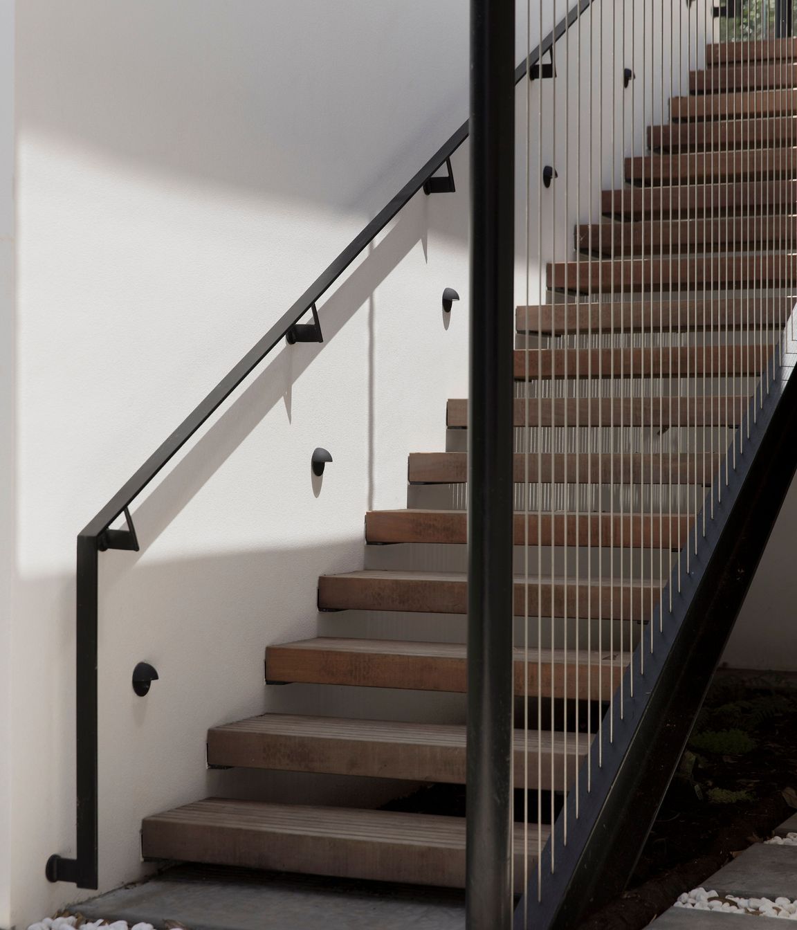 The staircase down to a keyhole-shaped swimming pool.