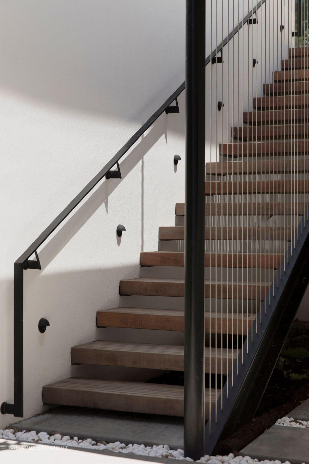 The staircase down to a keyhole-shaped swimming pool.