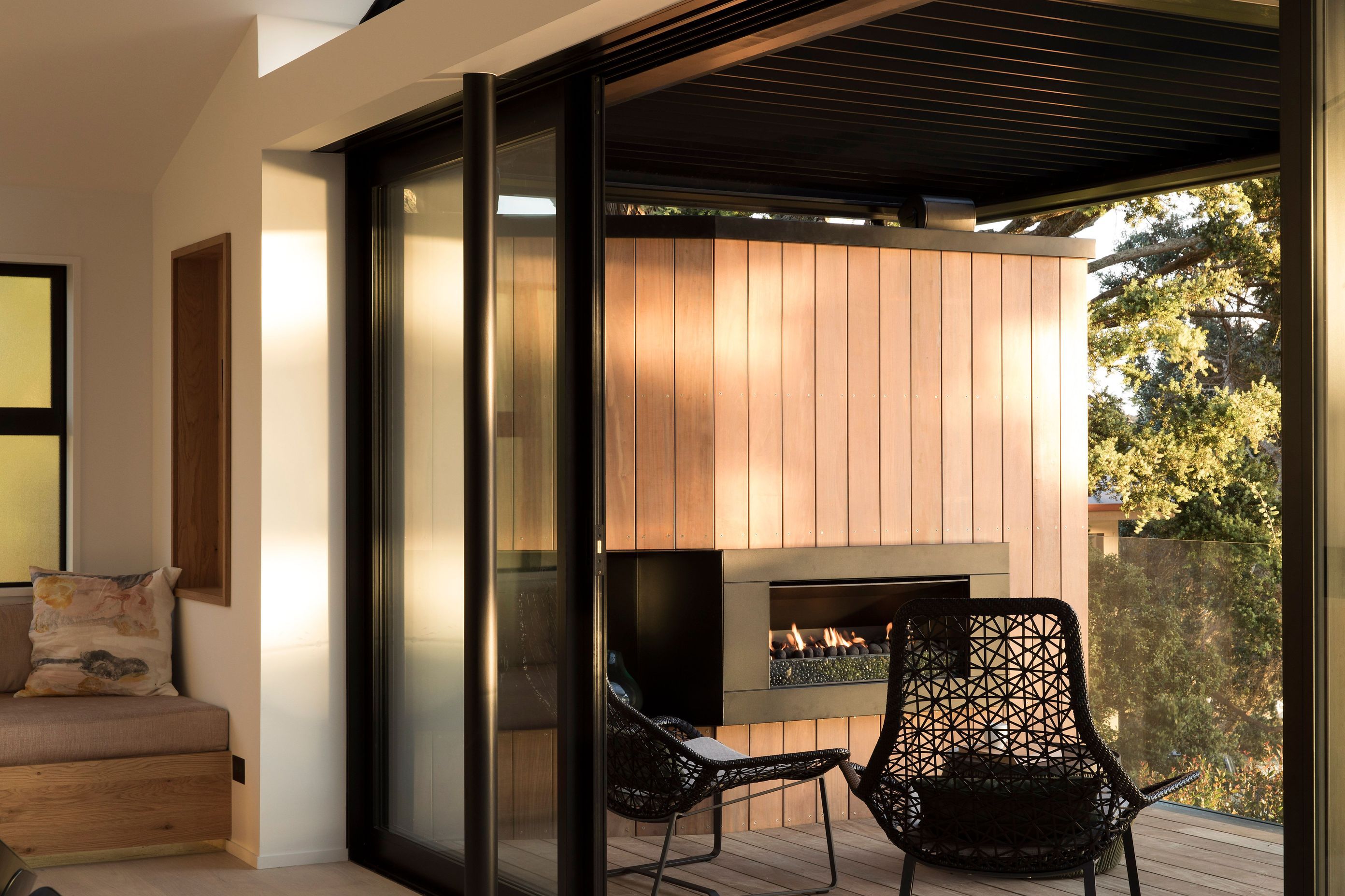 The covered terrace from the dining area features an in-built outdoor gas fire and louvres to control the shade.