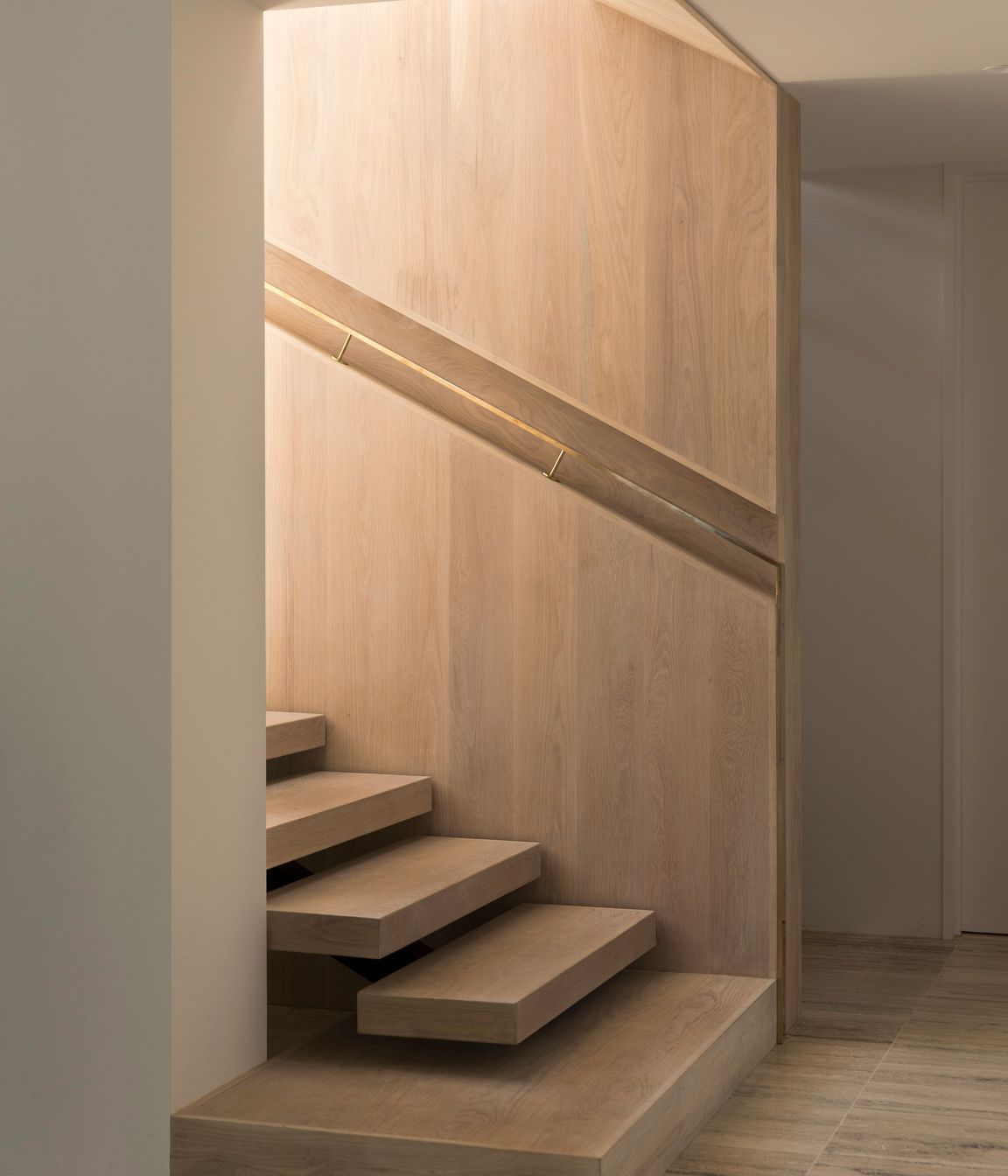 The staircase up to the first-floor living space and bedrooms.