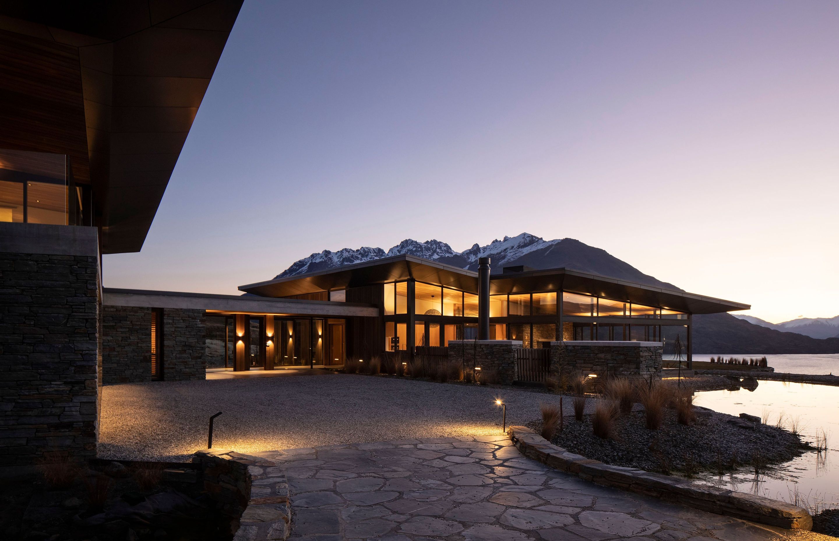 A night view of the house in the landscape, as seen from the driveway as you approach the house.  Photograph:  Simon Devitt.