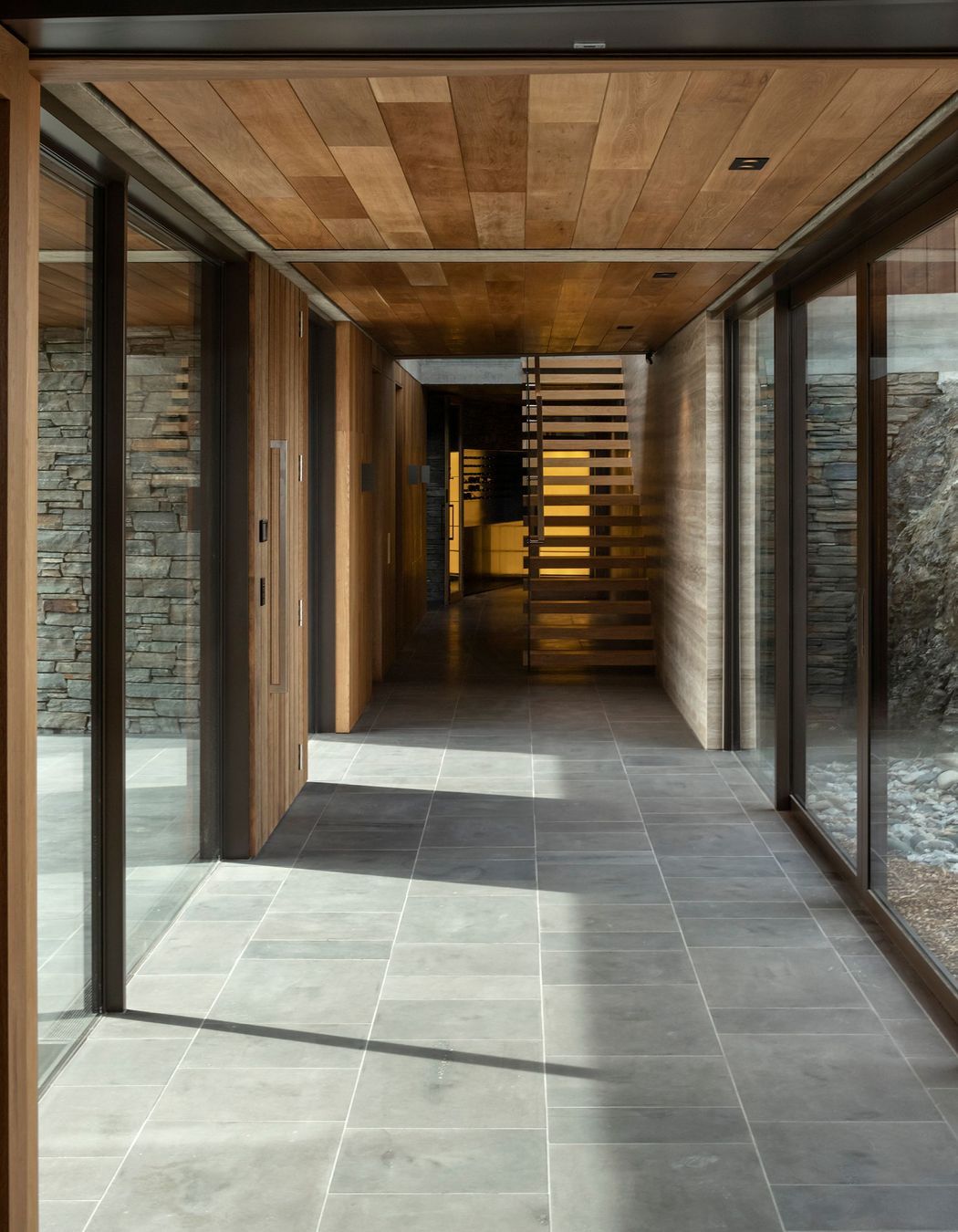 The passage to the stairwell to the upper floor, with courtyards on either side. SD
