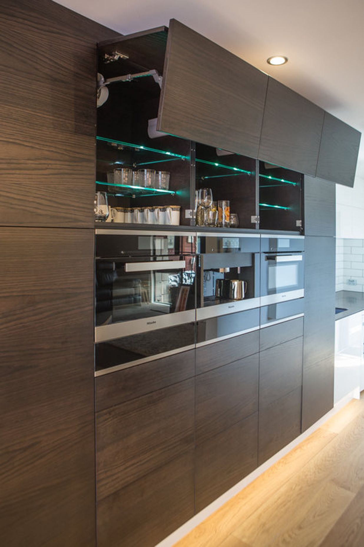 Blum Servo-drive hardware is used, and Miele appliances - steam oven, pyrolytic oven and built-in coffee machine.