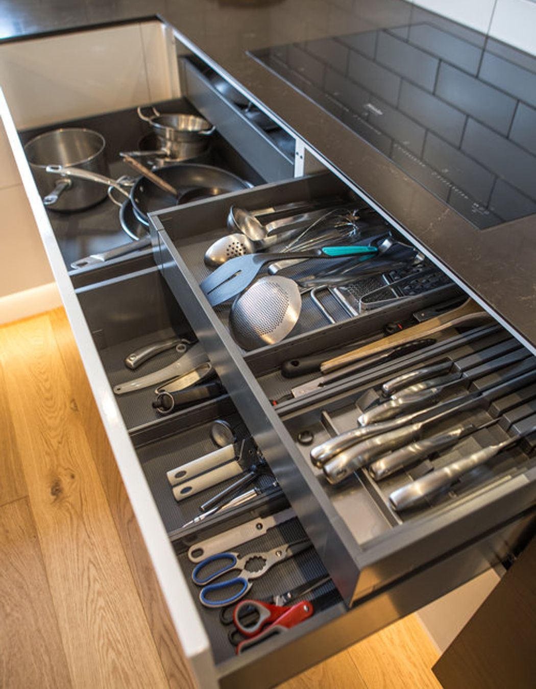 Electronic opening drawers for equipment storage - all small appliances and equipment have a place in this kitchen – specific storage designed for all items.