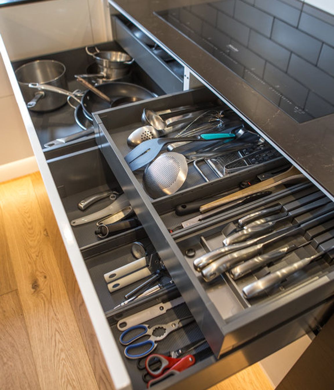 Electronic opening drawers for equipment storage - all small appliances and equipment have a place in this kitchen – specific storage designed for all items.