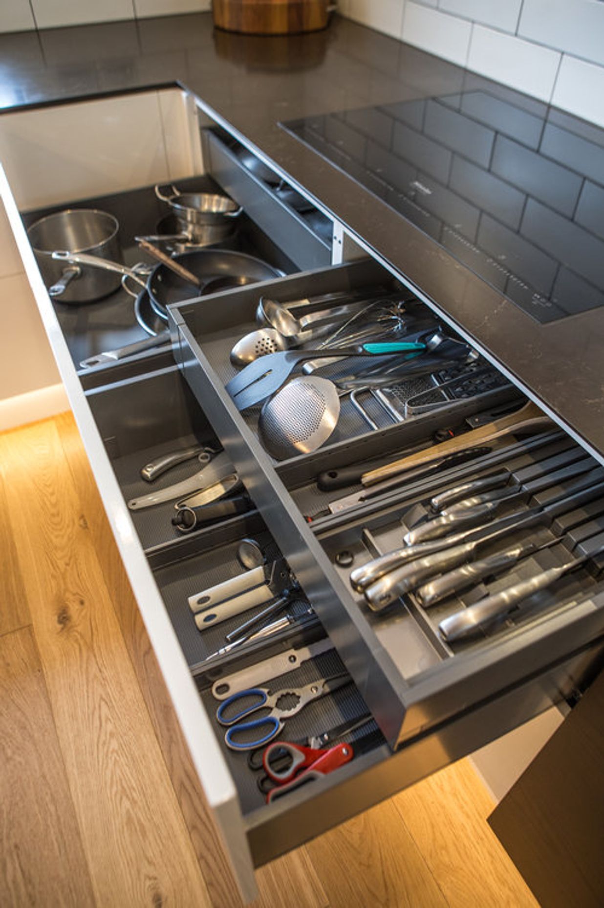 Electronic opening drawers for equipment storage - all small appliances and equipment have a place in this kitchen – specific storage designed for all items.