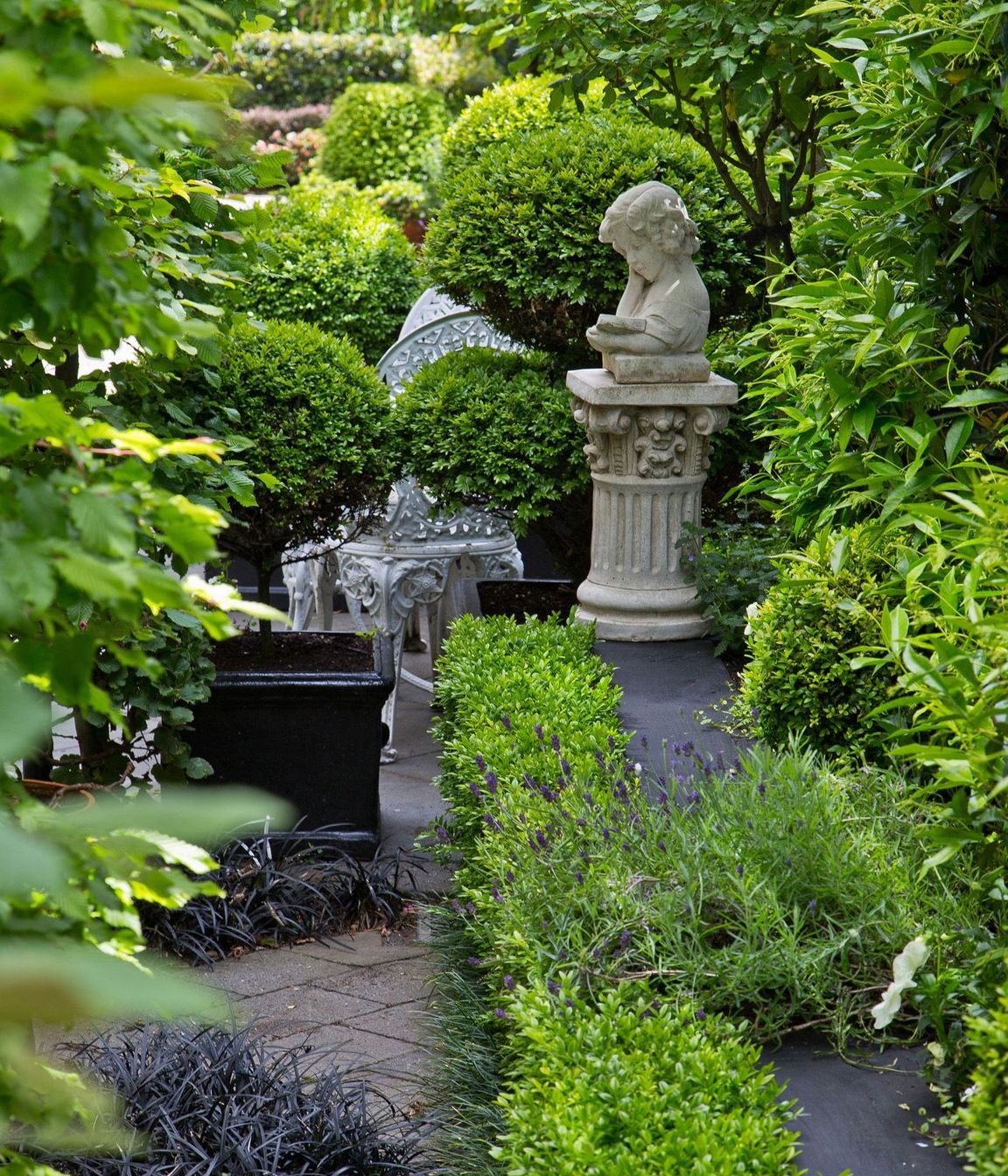 Long narrow garden divided into rooms