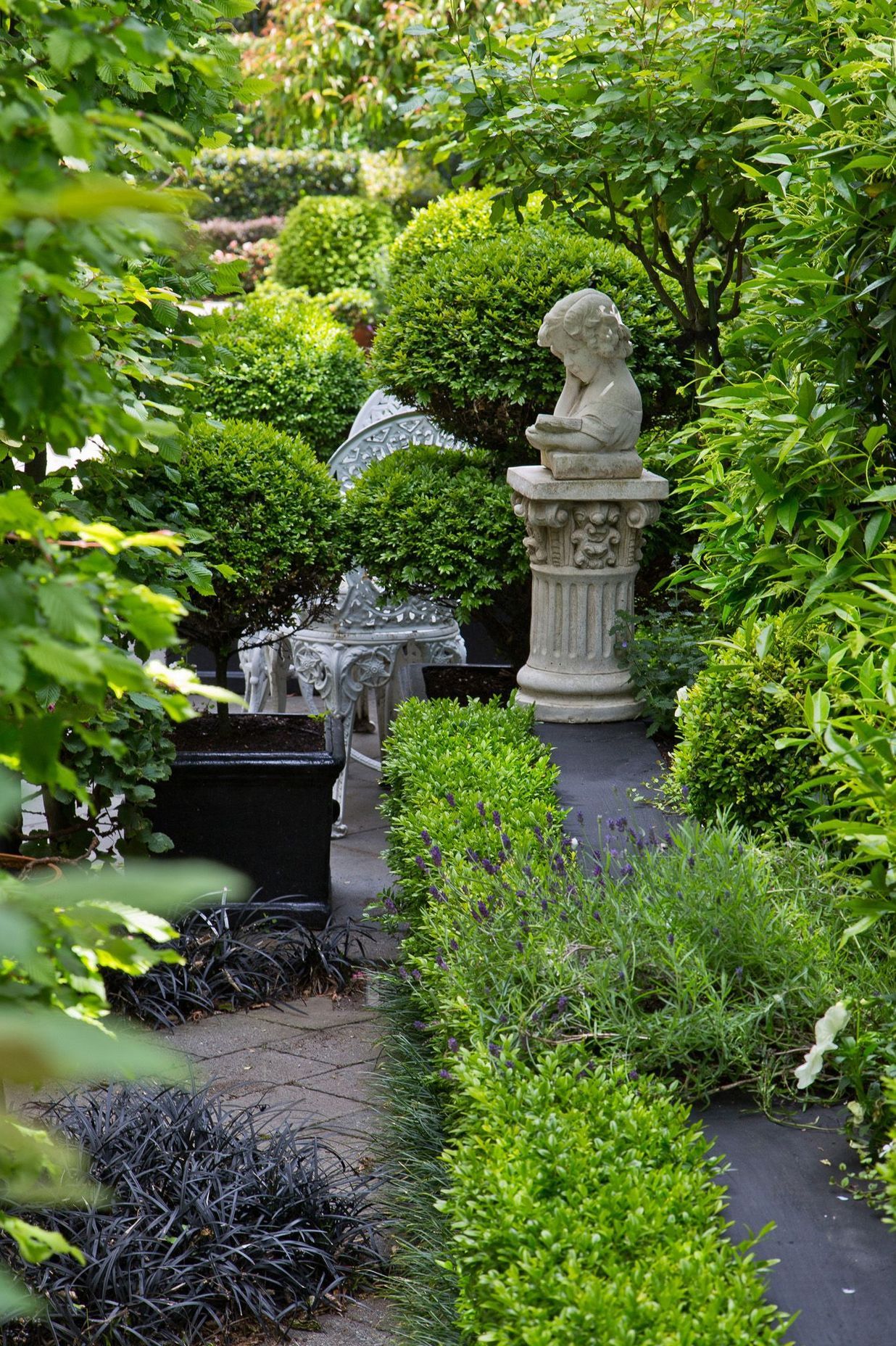 Long narrow garden divided into rooms