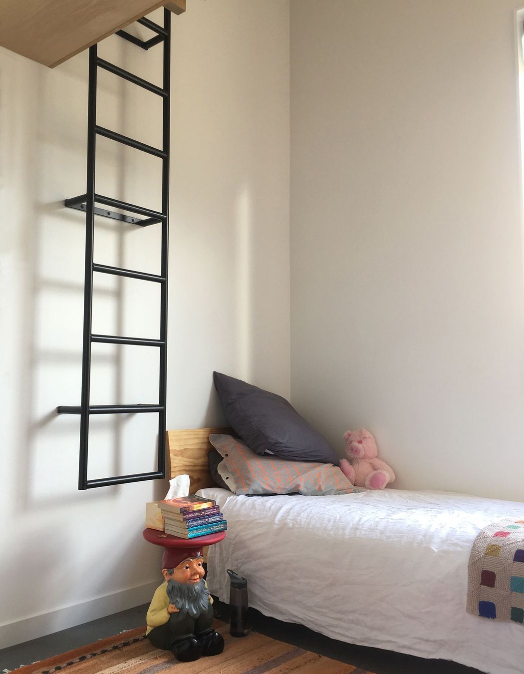 One of the children's bedrooms has a ladder to a mezzanine playspace.