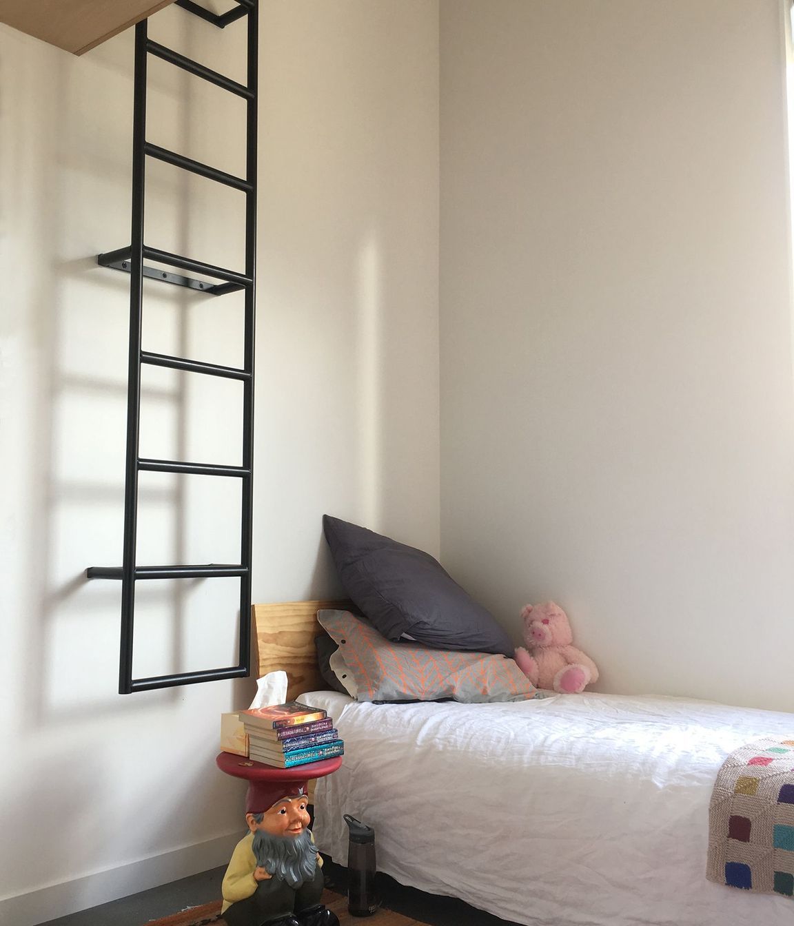 One of the children's bedrooms has a ladder to a mezzanine playspace.