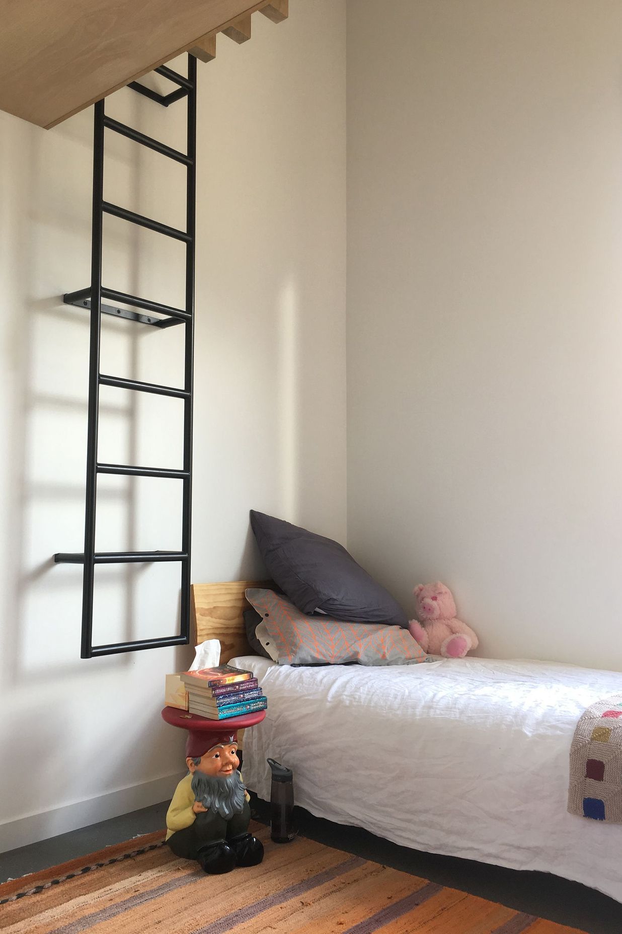 One of the children's bedrooms has a ladder to a mezzanine playspace.