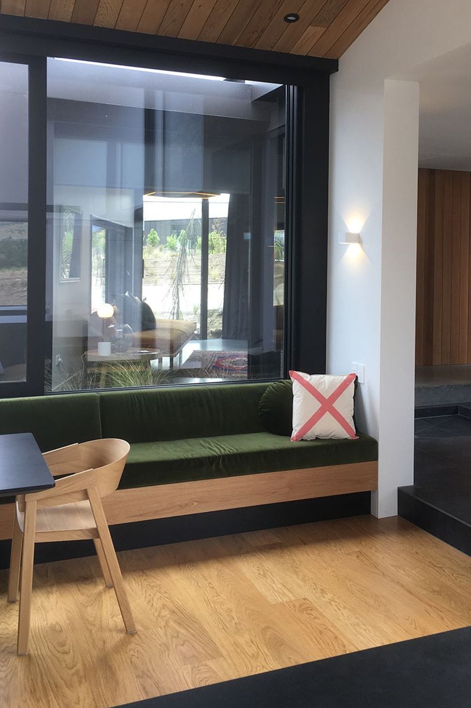 The built-in timber bench seating matches the timber in the flooring and ceilings.