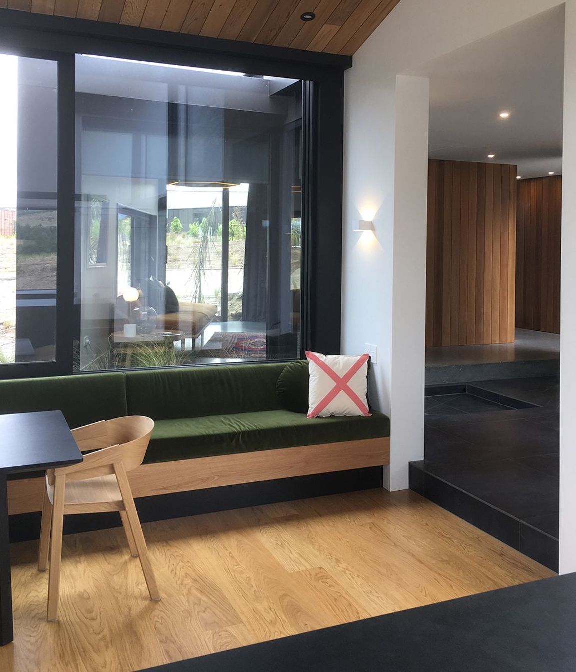 The built-in timber bench seating matches the timber in the flooring and ceilings.