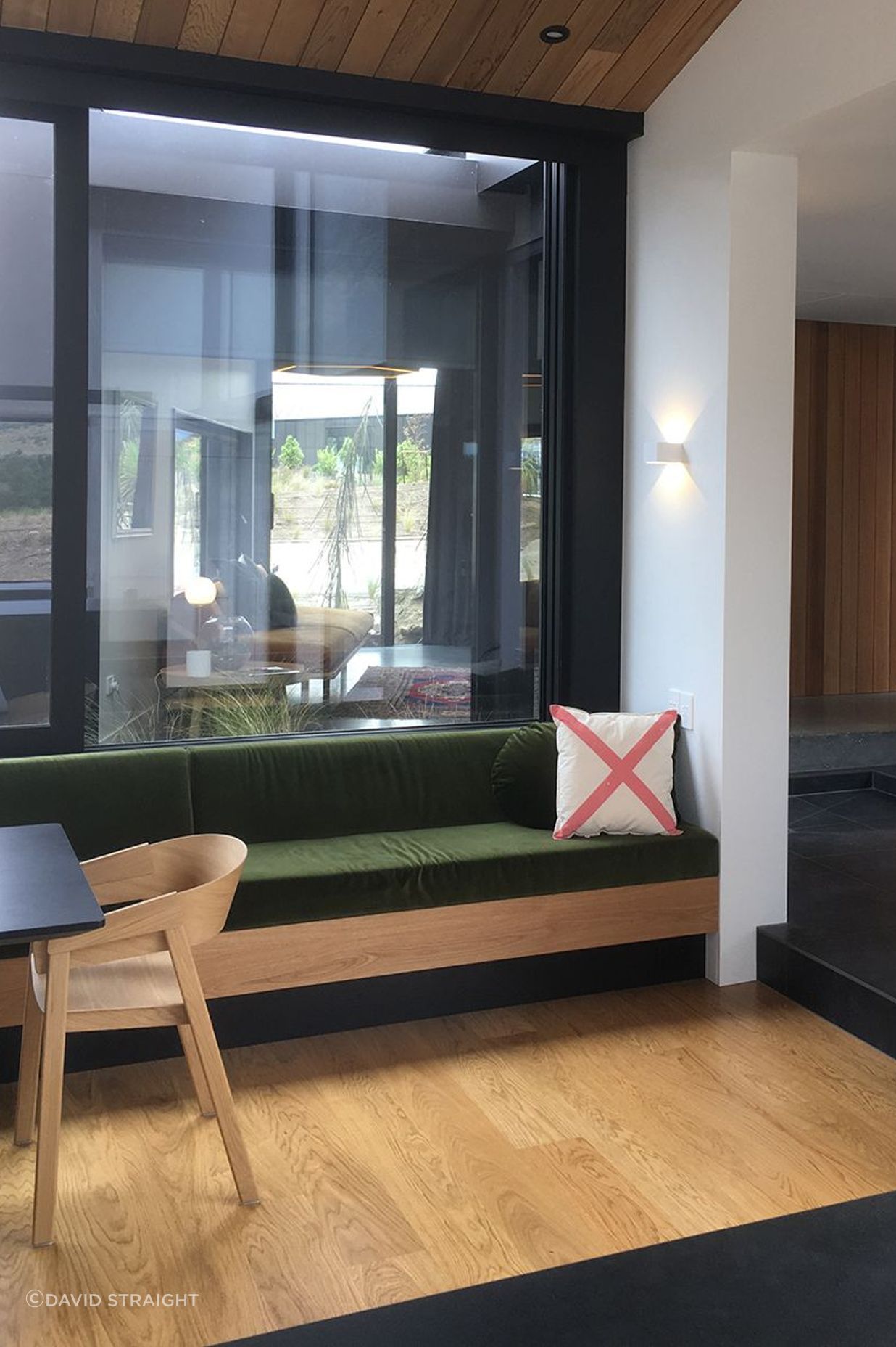 The built-in timber bench seating matches the timber in the flooring and ceilings.