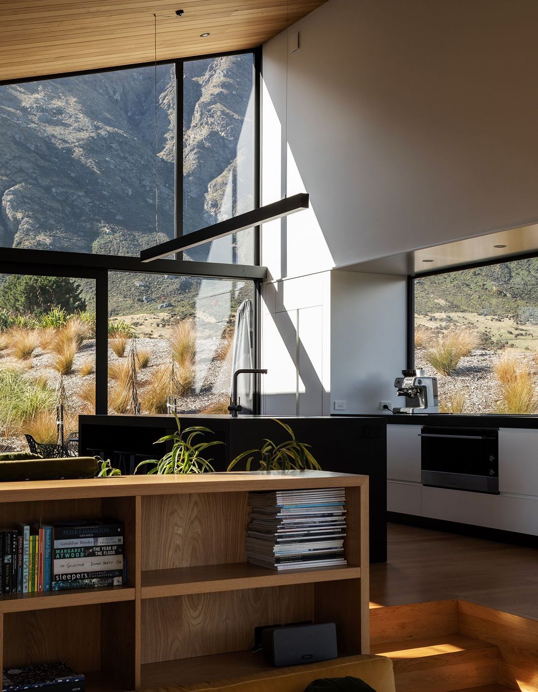 The lofty kitchen has mountain views in all directions, including through the pantry.