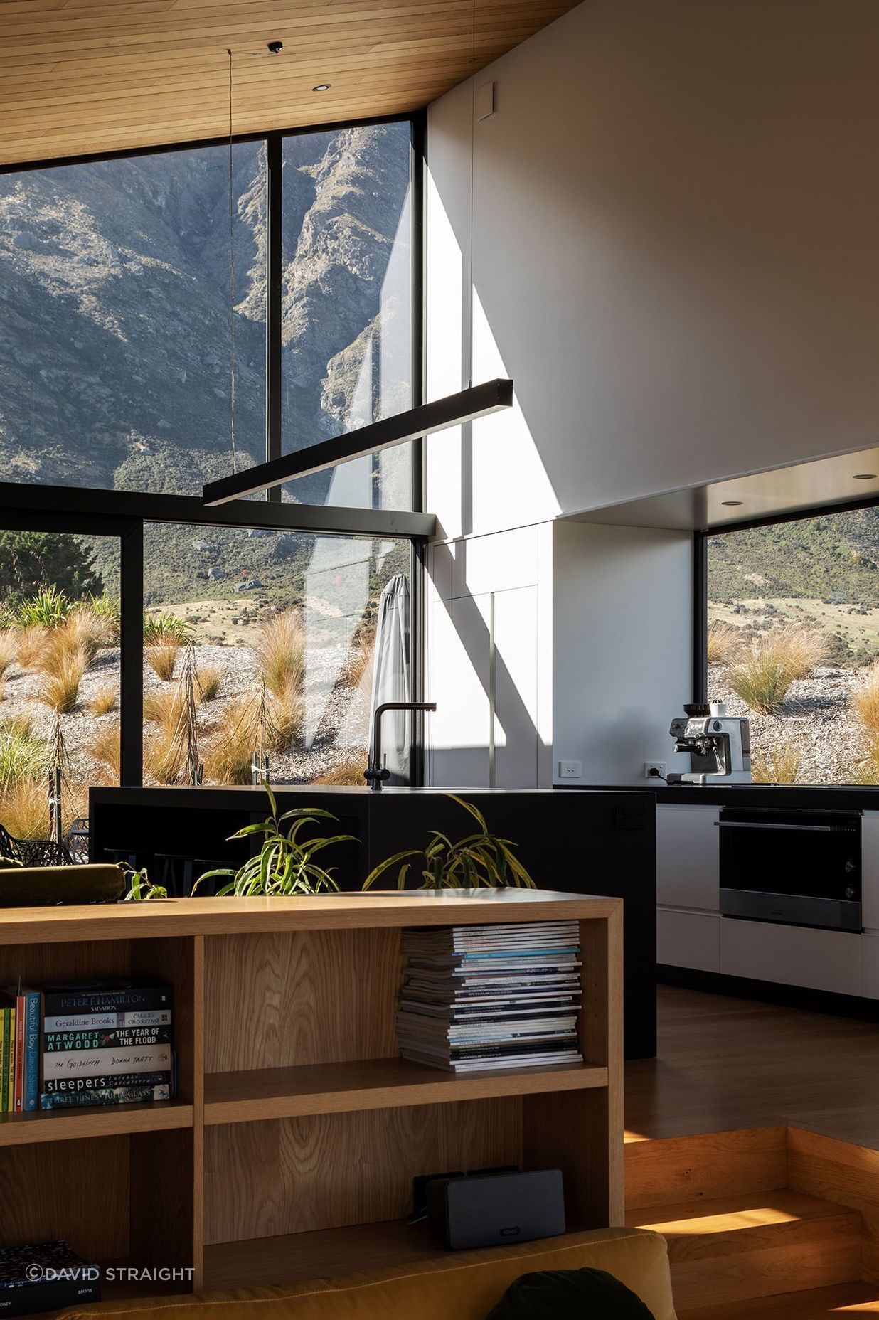 The lofty kitchen has mountain views in all directions, including through the pantry.