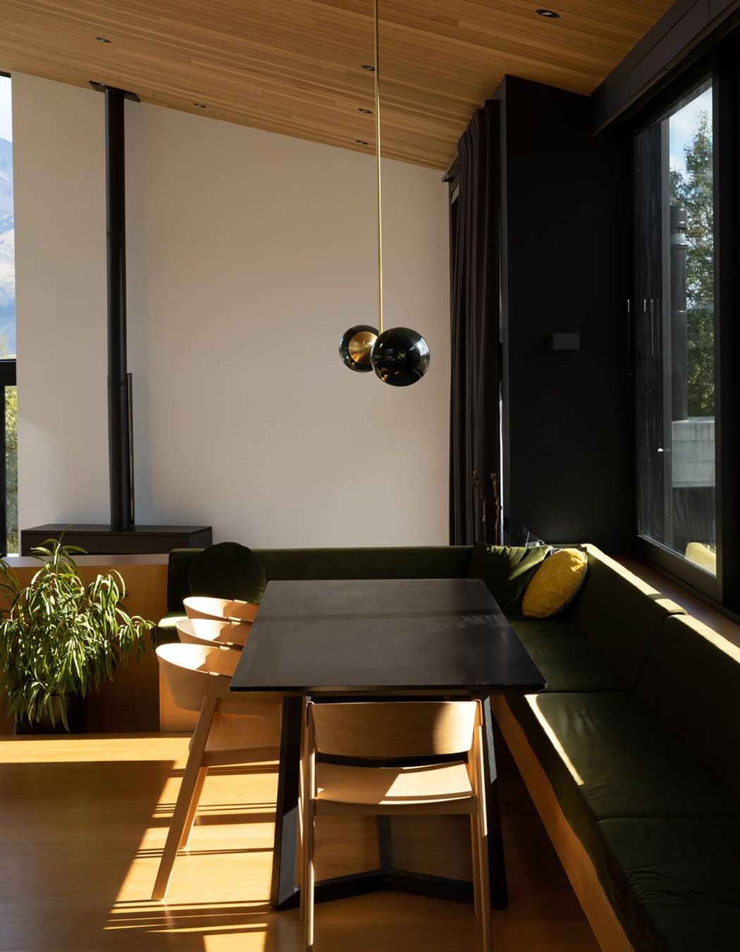 The dining area has cosy built-in seating that forms an 'L' around the edge of the space.