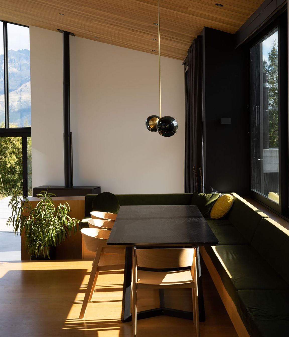 The dining area has cosy built-in seating that forms an 'L' around the edge of the space.