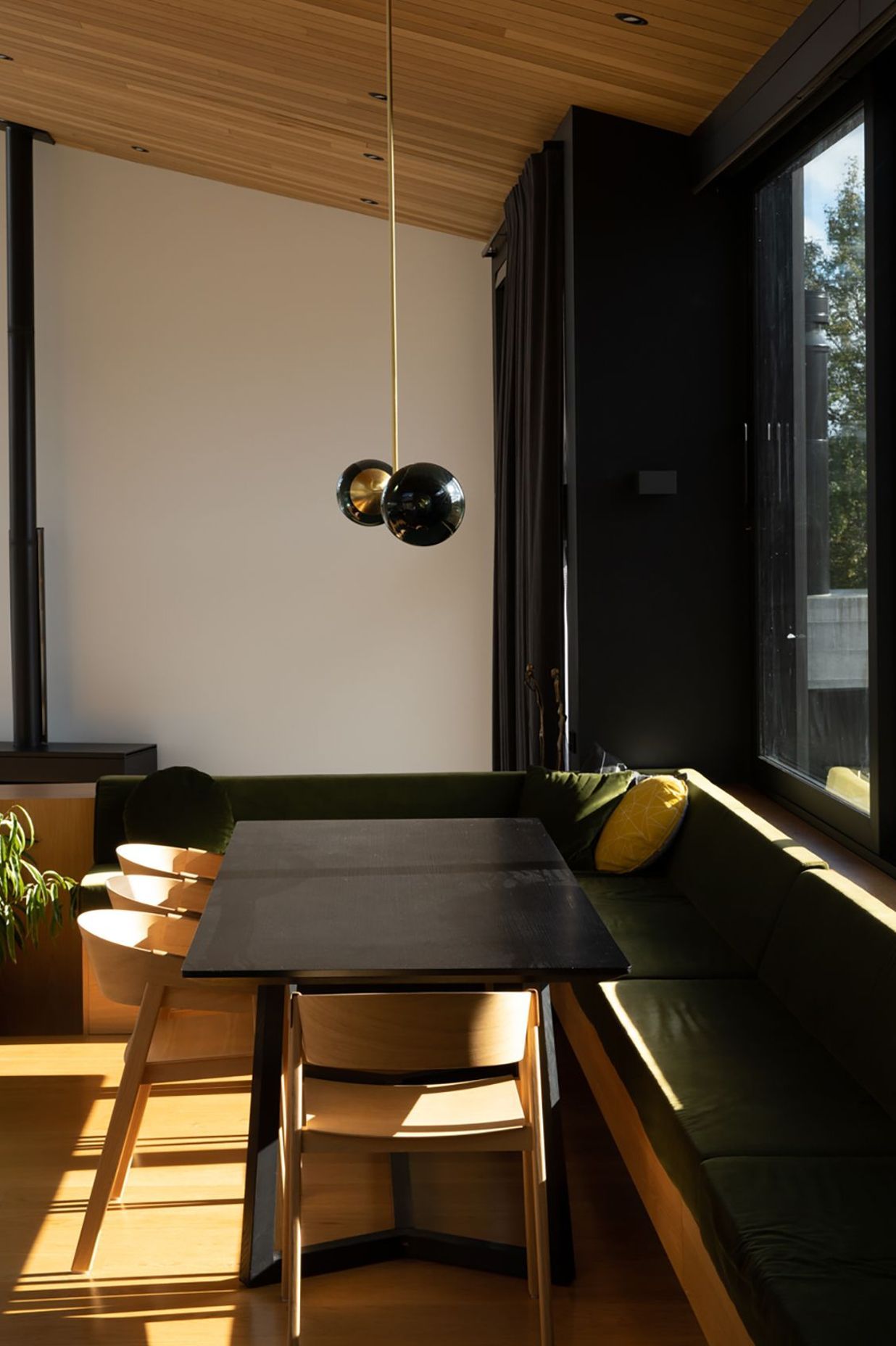 The dining area has cosy built-in seating that forms an 'L' around the edge of the space.